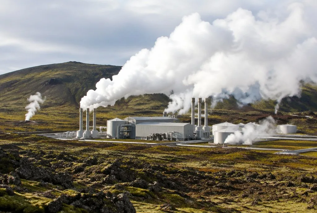 Renewable Energy Sources geothermal power plant with steam rising in a volcanic landscape